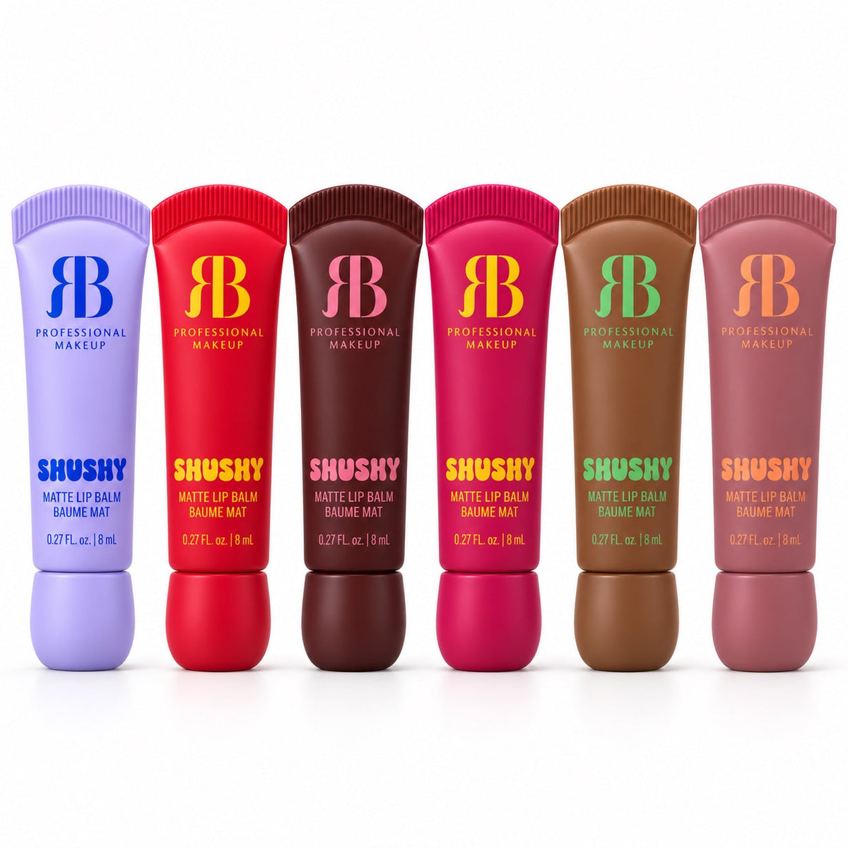 Seis bálsamos labiales mate SHUSHY, de izquierda a derecha: piña lila, galleta rojo, chocolate marrón, tarta de queso fucsia, caramelo salado marrón claro y cereza rosa nude