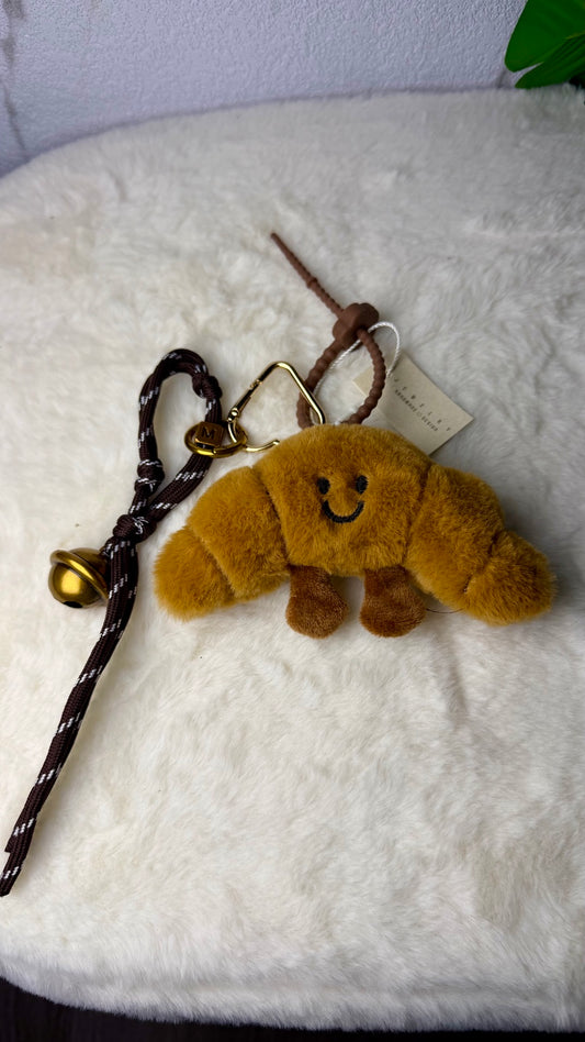 Llavero de peluche Croissant Happy con colgantes, cascabel y mosquetón para bolso